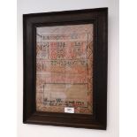 A George IV sampler, dated 1828, 23cm x 35cm, in oak frame and glazed.