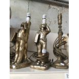 One brass and two plaster table lamps