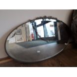 An oval bevelled edged mirror
