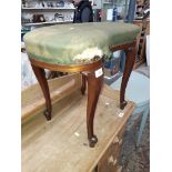 A 19th century kidney shaped dressing table stool