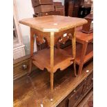 An Arts & Crafts style oak two tier table