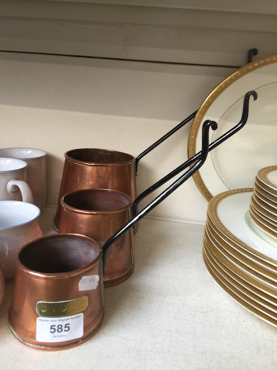 A set of 3 copper graduated cider measures