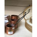 A set of 3 copper graduated cider measures