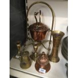A quantity of brass and copper ware including a spirit kettle on stand, a pair of candlesticks, an