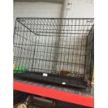 A medium sized dog crate.