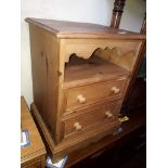 A pine bedside cabinet