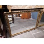 A gold framed mirror