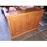 A pine two door cupboard