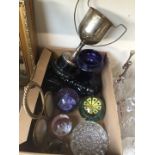 A small box of paperweights, candlesticks, etc.