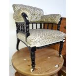 An Edwardian upholstered armchair