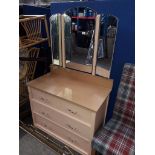 A dressing table chest with triple mirror