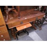 A two drawer Victorian pine writing table