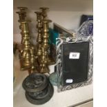 4 pairs of brass candlesticks, photo frames, letter rack and other metalware