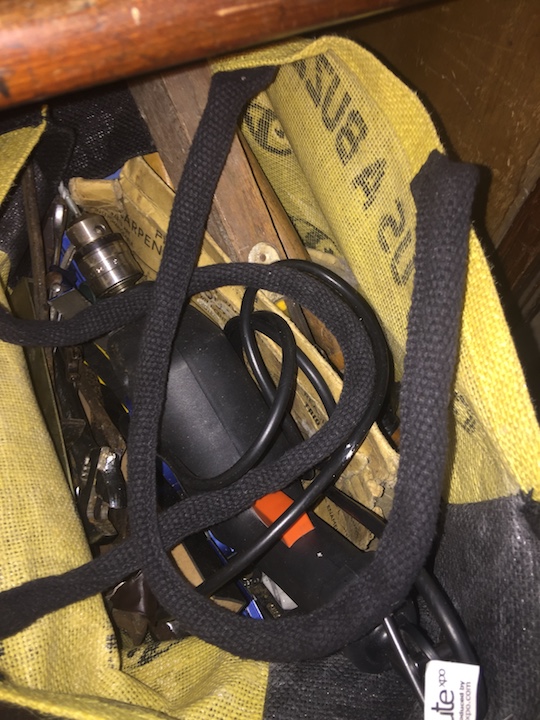 A bag of tools to include Black & Decker drill, etc.