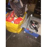 A tile table saw and a bag of cables, bulbs, etc