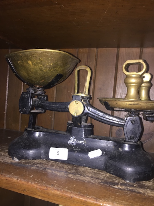 A vintage Librasco cast metal set of scales with brass plates and weights.