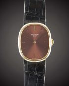 A GENTLEMAN'S 18K SOLID GOLD PATEK PHILIPPE ELLIPSE WRIST WATCH CIRCA 1980s, REF. 3648 WITH BURGUNDY