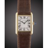 A GENTLEMAN'S SIZE 18K SOLID GOLD CARTIER TANK WRIST WATCH CIRCA 1980s Movement: Manual wind, signed