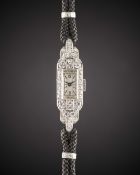 A FINE LADIES PLATINUM & DIAMOND PATEK PHILIPPE COCKTAIL WRIST WATCH CIRCA 1930s Movement: Manual