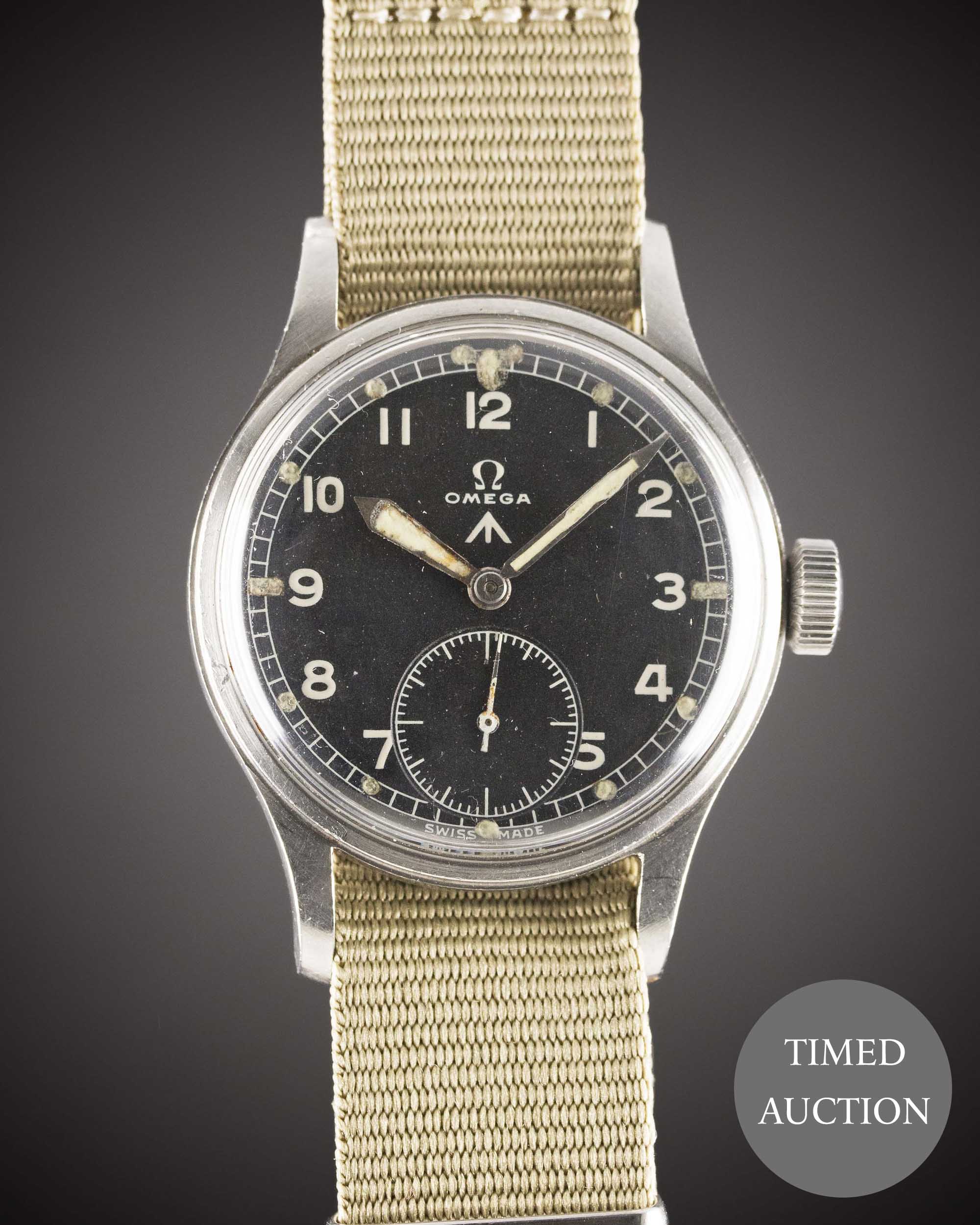 A GENTLEMAN'S STAINLESS STEEL BRITISH MILITARY OMEGA W.W.W. WRIST WATCH CIRCA 1940s, PART OF THE "