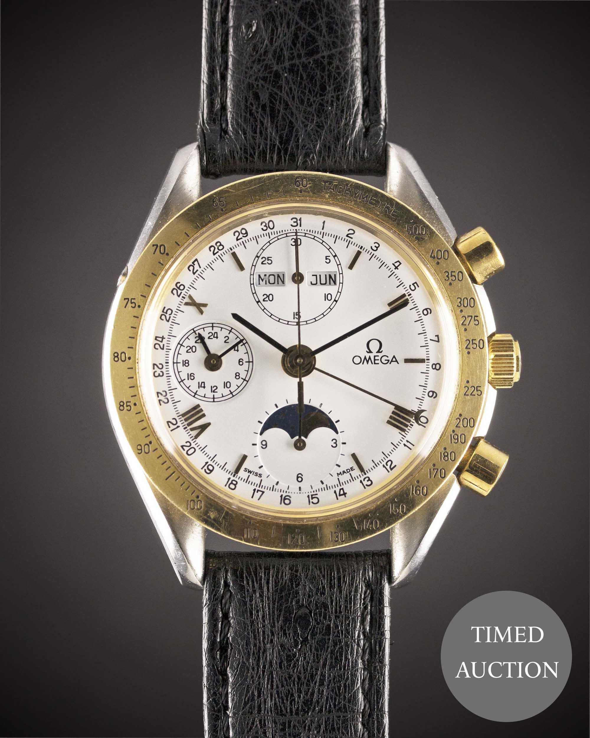 A GENTLEMAN'S STEEL & GOLD OMEGA SPEEDMASTER MOONPHASE TRIPLE CALENDAR AUTOMATIC CHRONOGRAPH WRIST