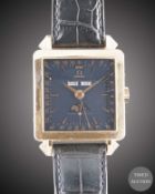 A GENTLEMAN'S 18K SOLID ROSE GOLD OMEGA COSMIC 1951 TRIPLE CALENDAR MOONPHASE AUTOMATIC WRIST