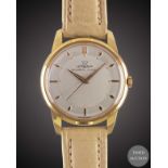 A GENTLEMAN'S "NOS' GOLD PLATED LEMANIA AUTOMATIC WRIST WATCH CIRCA 1950s, TWO TONE SILVER DIAL &