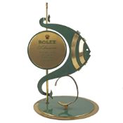 A RARE GILT METAL & ENAMEL ROLEX SUBMARINER WATCH STAND CIRCA 1960s Rolex Submariner display stand