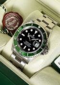 A GENTLEMAN'S STAINLESS STEEL ROLEX OYSTER PERPETUAL DATE "ANNIVERSARY" SUBMARINER BRACELET WATCH