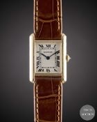 A LADIES 18K SOLID GOLD CARTIER TANK WRIST WATCH CIRCA 2000, REF. 1150 WITH CARTIER BOX & OPEN