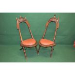 Probably Egyptian 19th century pair of North African tribal chairs with camel saddle backs