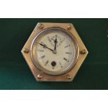Brass and glass hexagonal cased desk clock the dial having Roman Numerals,