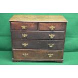 Oak chest of two short and three long graduated drawers having brass handles and escutcheons,