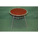 Mid century circular occasional table having red glass top with mirrored border,