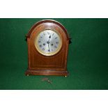 Mahogany inlaid cased 8 day mantle clock the case having domed top and standing on brass bun feet,