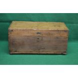 Camphor wood chest opening to reveal storage space and having brass bound corners,