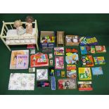 Quantity of 1960's children's items and games to include: wooden cot, card figure dressing sets,