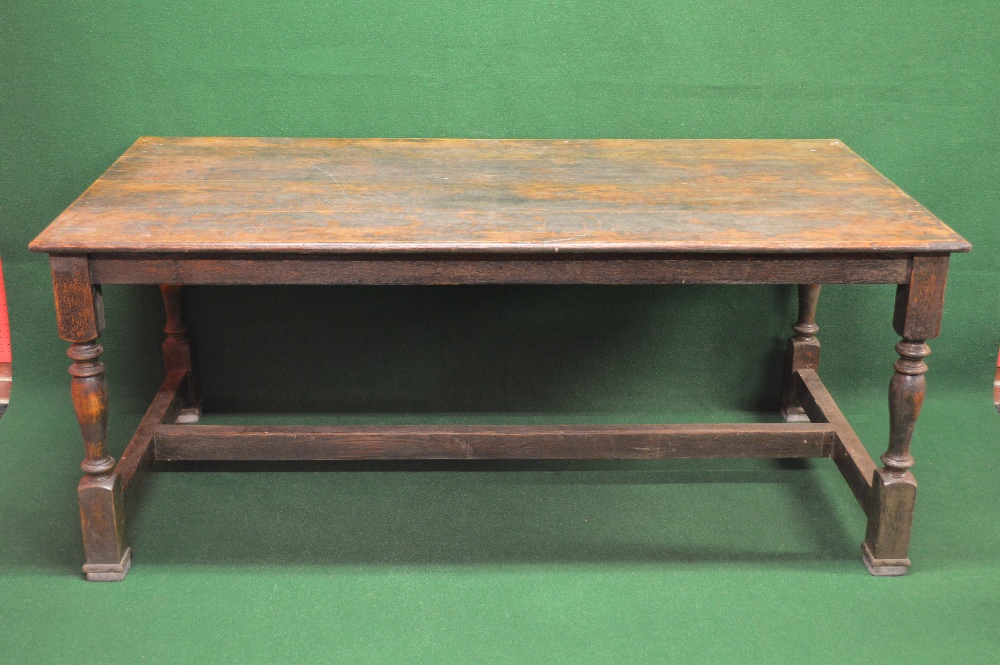 Oak refectory dining table having four plank top with moulded edge supported on block and turned H