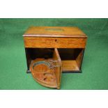 Oak smokers cabinet the top having brass presentation plaque opening to reveal three section