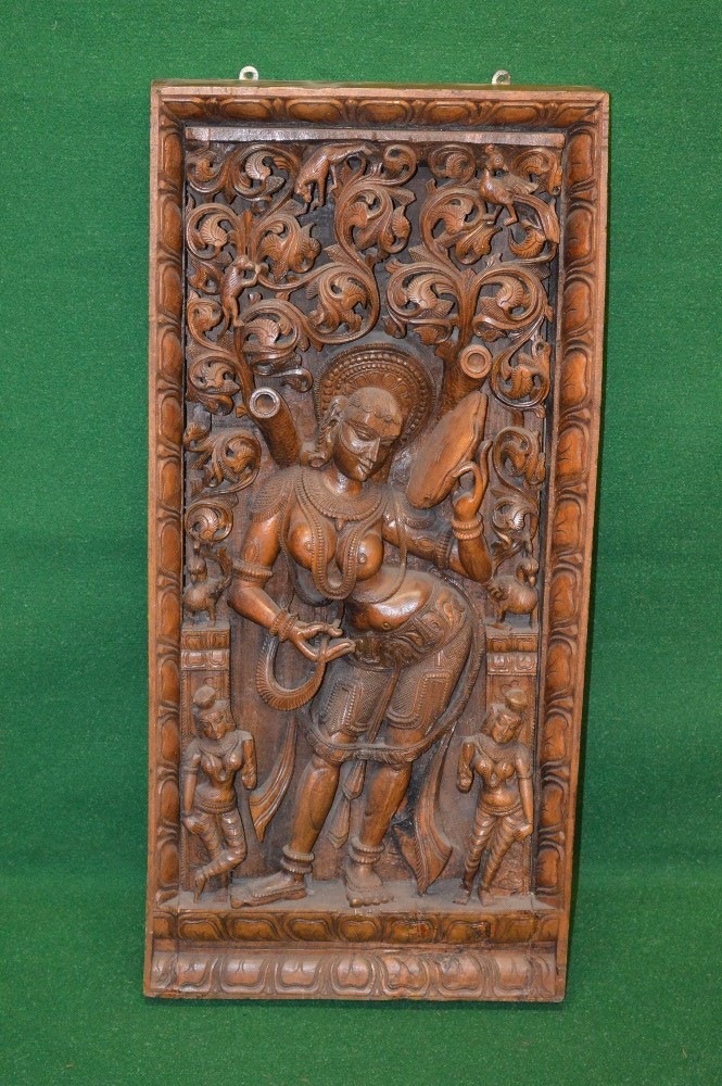 Late 19th/early 20th century Indian carved hardwood panel having central carved decoration of a