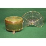 Oval brass coal bin having side carrying handles and lions paw feet together with a brass framed