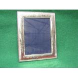 Silver photograph frame having beaten metal finish with embossed borders, marked 925 - 7" x 9.