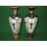Pair of Royal Doulton pottery vases having raised decoration of flowers,