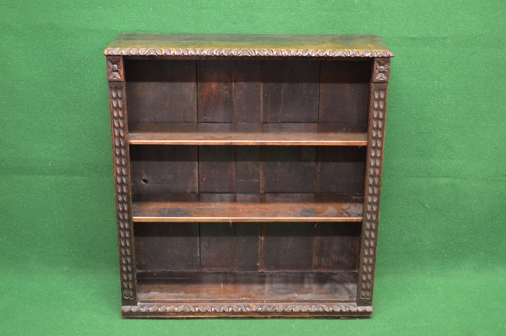 Oak carved bookcase having two adjustable shelves - 33.