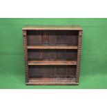 Oak carved bookcase having two adjustable shelves - 33.