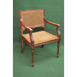 Beech framed open armchair having cane back and seat the open arms supported on reeded uprights
