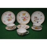 Group of three Dresden floral decorated cabinet plates, two cups with matching saucers,