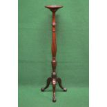 Mahogany torchere having circular top supported on a bulbous reeded upright leading to three