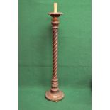 Gilt painted standard lamp having twist column support leading to a circular carved base,