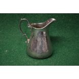 Victorian silver milk jug having engraved decoration,